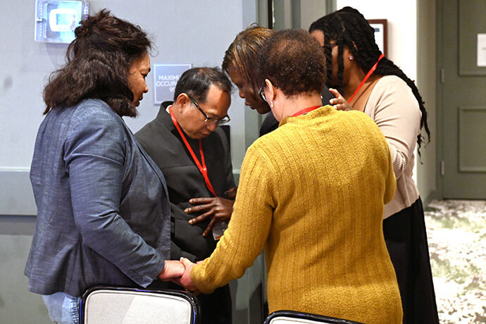 A group of pastors pray together Oct. 8 during the Facing the Future 2025 conference in Los Angeles. Photo by Jim Patterson, UM News.