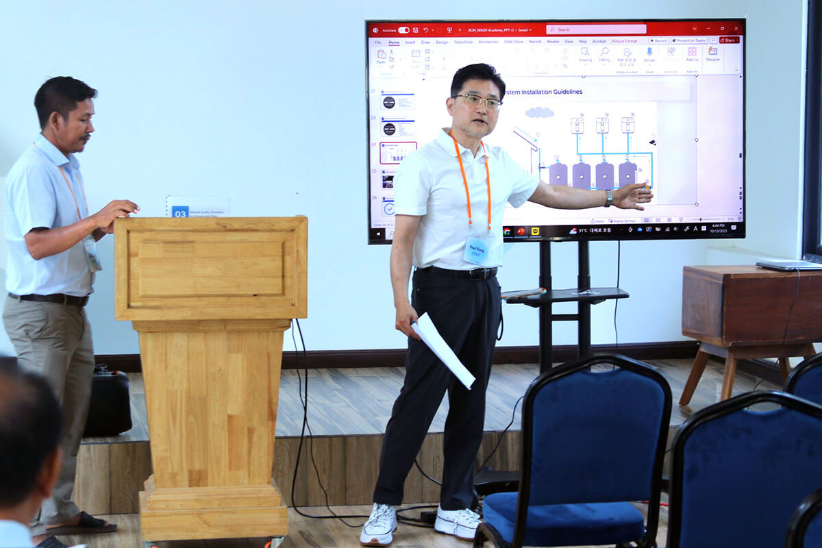 The Rev. Paul Kong, United Methodist Board of Global Ministries Asia-Pacific regional representative, explains how rainwater-harvesting tanks are converted into drinking water during a WASH Academy, held Oct. 13-17 at Hope Vocational School in Phnom Penh, Cambodia. The training was hosted by Global Ministries and its Korean partner nongovernmental organization Bridge of Hope. Photo by the Rev. Thomas E. Kim, UM News.