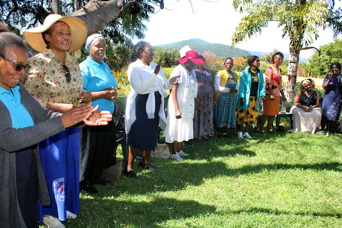 Women of Substance members sing during a Mountain Prayer Program at Ewanrigg Botanical Gardens in Harare, Zimbabwe. The group comprises single, divorced and widowed church members who participate in training in income-generating projects, prayer retreats and other excursions. Photo by Kudzai Chingwe, UM News.