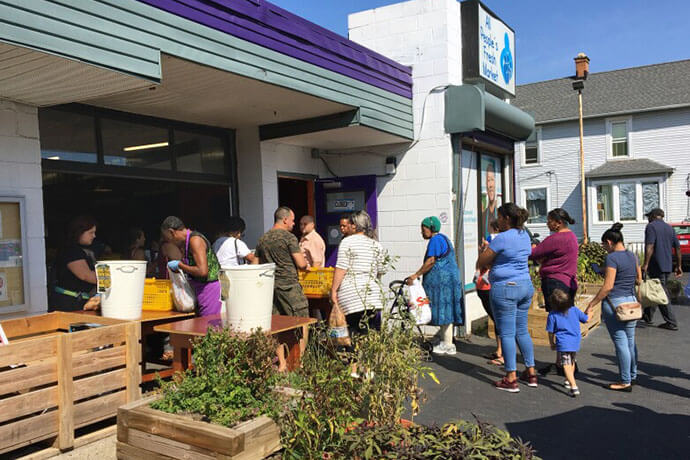 People wait to enter the All People’s Fresh Market, a ministry of United Methodist Church and Community Development for All People in Columbus, Ohio. The market serves an average of 450 people each weekday and gives out more than 3 million pounds of fresh produce every year. Photo courtesy of the Rev. Joelle Henneman, United Methodist Church for All People.
