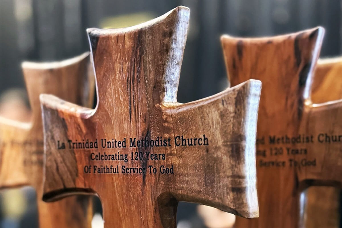 Wooden crosses are presented as a special recognition to several participants in the celebration of the 120th anniversary of La Trinidad United Methodist Church in May. La Trinidad in Seguin, Texas, has been a source of Hispanic leaders for the denomination throughout its history. Photo by the Rev. Gustavo Vasquez, UM News.