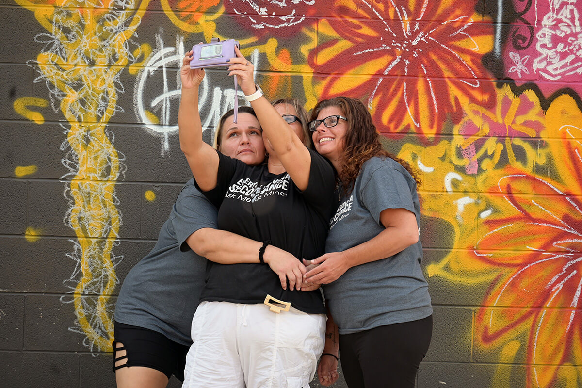 Members of Second Chance take a selfie in the courtyard of Franklinton High School in Columbus, Ohio, on Sept. 21. Second Chance is a new United Methodist faith community focused on people recovering from addictions. It frequently worships in the building, which previously housed a United Methodist church. Photo by Jim Patterson, UM News.
