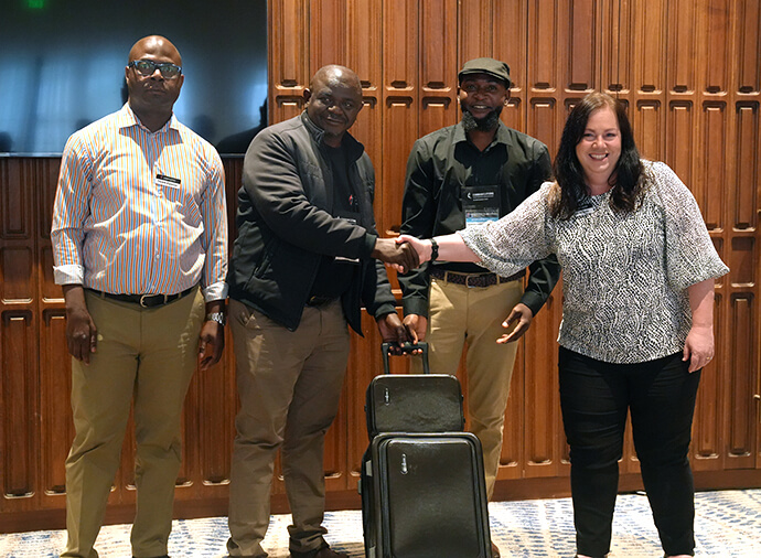The Rev. Taurai Emmanuel Maforo (second from left) of the Zimbabwe, Zambia, Malawi and Botswana Episcopal Area receives his area’s livestream kit from Jennifer Rodia (far right) and Pacome Nguessan (left) with United Methodist Communications. Rutendo Luckmore Kufarimayi, associate communications director for the episcopal area, looks on. The equipment was distributed to members of the United Methodist Broadcast Network at the group’s meeting in Harare, Zimbabwe, Nov. 19. Photo by Floreuce Dale Cancio of Baguio Episcopal Area.