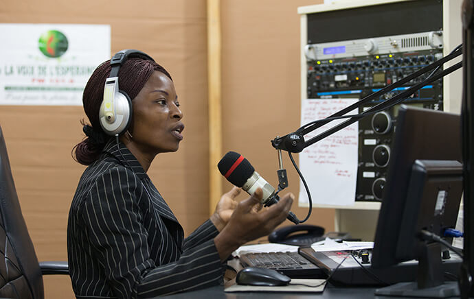 Viviane Daho broadcasts from The United Methodist Church's Voice of Hope radio station in Abidjan, Côte d'Ivoire, in 2018. The station was one of the founding members of the United Methodist Broadcast Network (formerly the United Methodist Radio Network), which was established a decade ago. File photo by Mike DuBose, UM News.