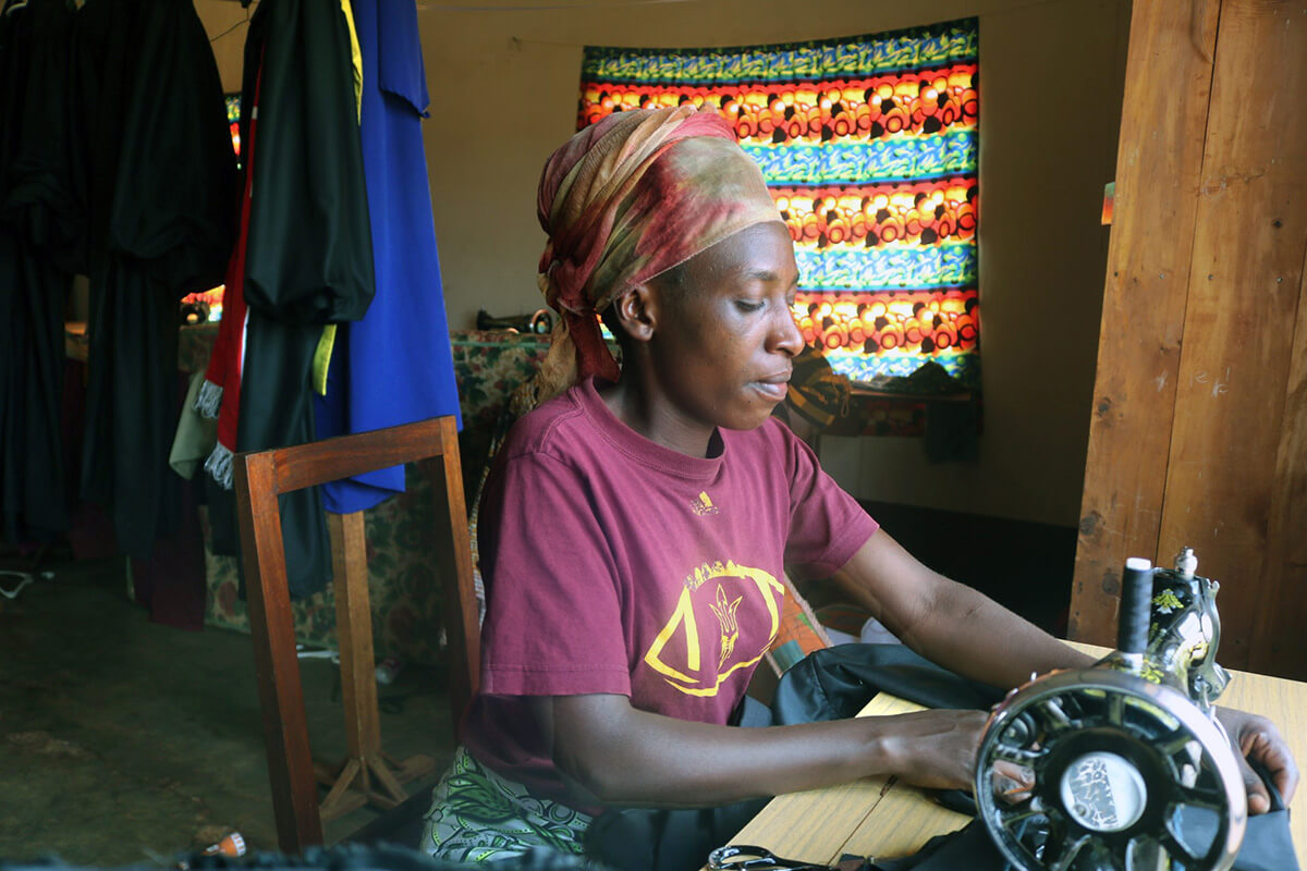 Josélyne Kubwimana, a graduate of the Burundi Conference’s tailoring school at Nyabugogo United Methodist Church in Gitega, sews a clerical stole. Kubwimana completed three months of training and now sews clergy attire and school uniforms to support herself and raise funds for the United Methodist Women’s Center. Photo by Eveline Chikwanah, UM News.