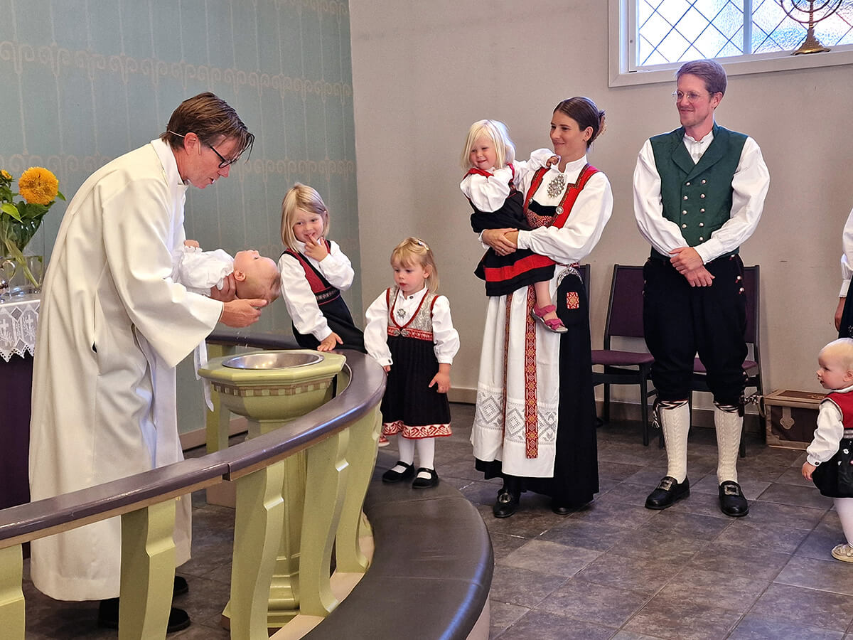 Bishop Knut Refsdal, who leads the Nordic-Baltic-Ukraine Area, baptizes Aksel, as the baby’s parents, Håkon and Astri Helen Madland, look on. The newly elected bishop chose Flekkefjord, Norway, as his first visit in a strong sign of solidarity with the United Methodists there. Photo by Karl Anders Ellingsen, UM News.  