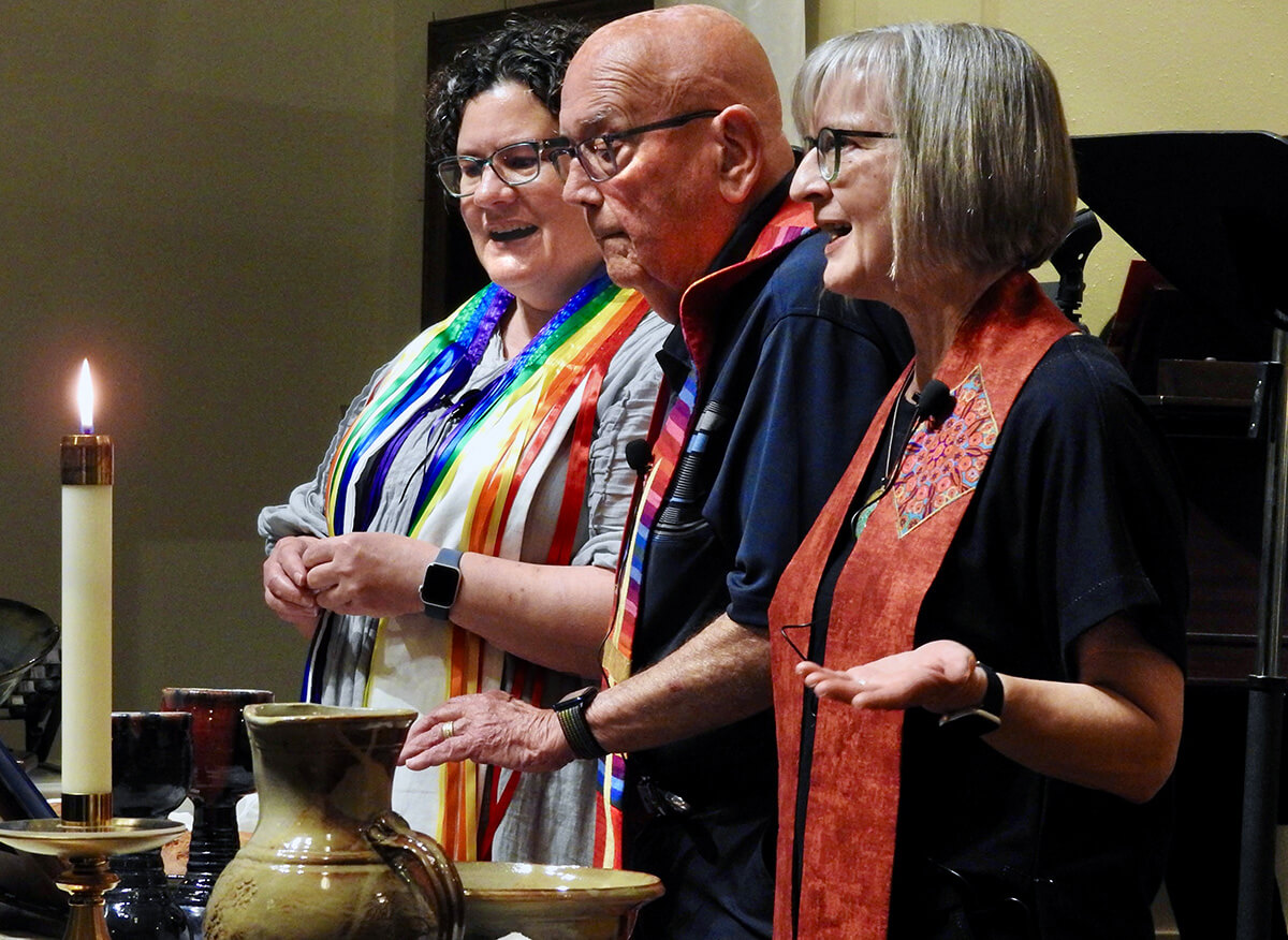Reinstated clergy members the Revs. Beth Stroud (left), Deen Thompson and Susan Morgan serve communion during a celebration of full inclusion for LGBTQ persons in The United Methodist Church. The event was at Dallas’ Greenland Hills United Methodist Church. Photo by Sam Hodges, UM News.