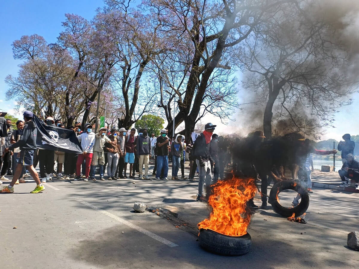 University students and unemployed youth protest in the streets as tires burn in Antananarivo, Madagascar. The demonstration followed earlier clashes between security forces and protesters voicing their frustration over social and economic conditions in the country. Photo by Rakotoarivony Esdras, UM News.