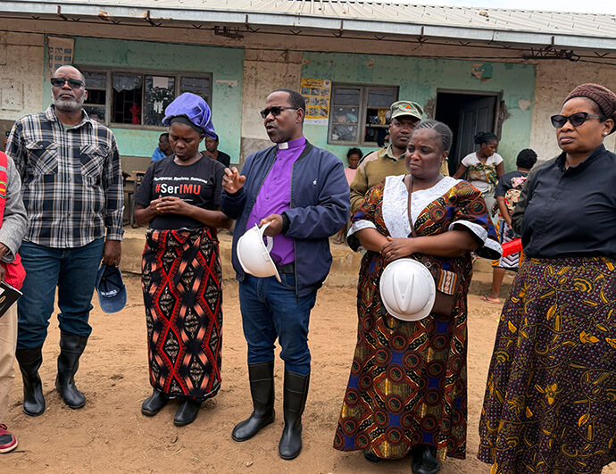 Mozambique Bishop João Filimone Sambo (third from left) and conference leaders visit a temporary shelter for flood survivors in Boane District in Maputo, Mozambique. The flooding destroyed more than 60,000 homes, leaving hundreds of thousands displaced. Photo by Roque Facela, UM News.