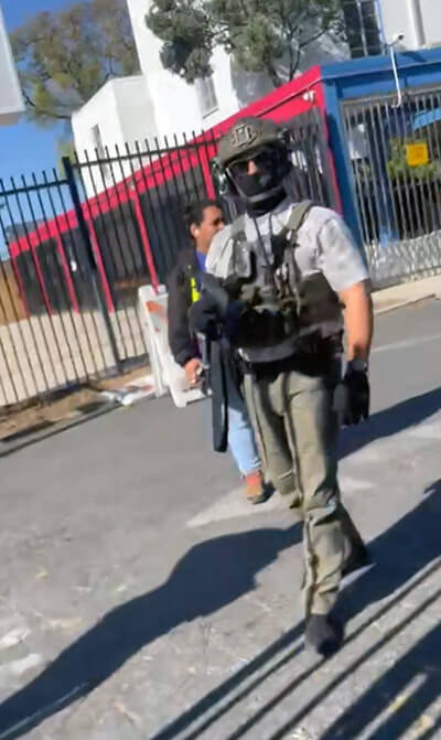 An officer with U.S. Immigration and Customs Enforcement at North Hills Hispanic Mission United Methodist Church in Los Angeles on Jan. 29. ICE was there to apprehend a church member, Carlos Chavez, who is undocumented. Photo courtesy of North Hills Hispanic Mission United Methodist Church. 