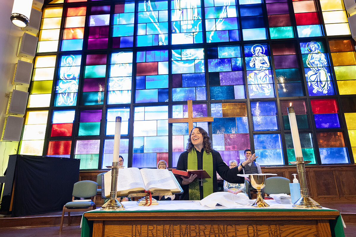 The Rev. Colleen Bookter blesses the elements of Holy Communion during worship at St. Luke’s United Methodist Church. File photo by Mke DuBose.