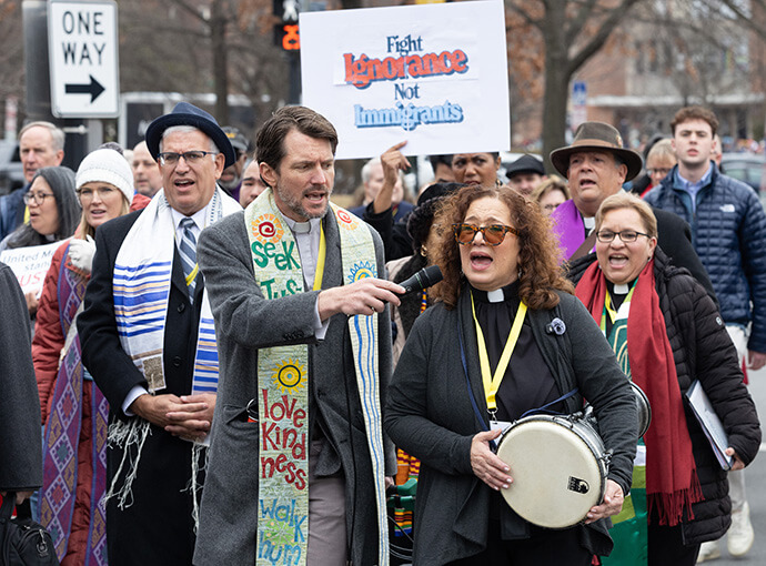 The Rev. Lydia Muñoz (with drum) leads singing while participants in “Faithful Resistance: A Public Witness for Immigrant Justice” make their way toward the U.S. Capitol in Washington. Photo by Mike DuBose, UM News.