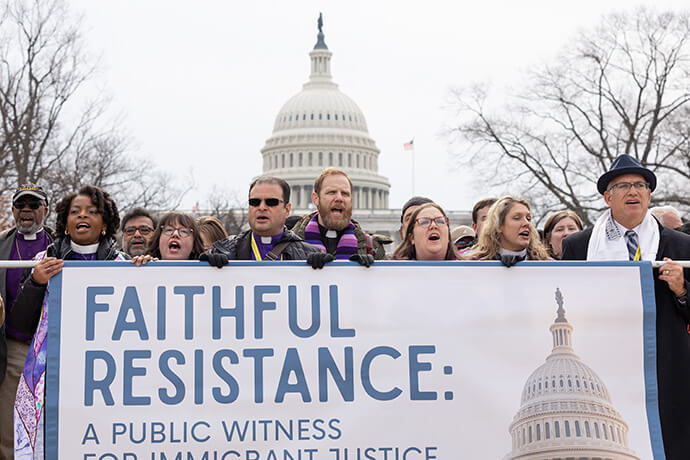 Faith leaders chant in front of the U.S. Capitol during “Faithful Resistance: A Public Witness for Immigrant Justice” in Washington. Holding the left end of the banner is United Methodist Bishop Cynthia Moore-Koikoi. Third from left is Bishop Héctor Burgos-Núñez. At center is the Rev. Eric Mayle of Edgehill United Methodist Church in Nashville, Tenn. Photo by Mike DuBose, UM News.