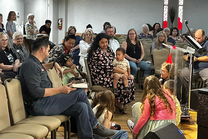 Members of Martin United Methodist watch over a circle of children at the church in Bedford, Texas. The politically diverse congregation focuses on “serving Jesus alongside each other” rather than their political differences, says the Rev. Daniel Hawkins. Photo courtesy of Martin United Methodist Church.