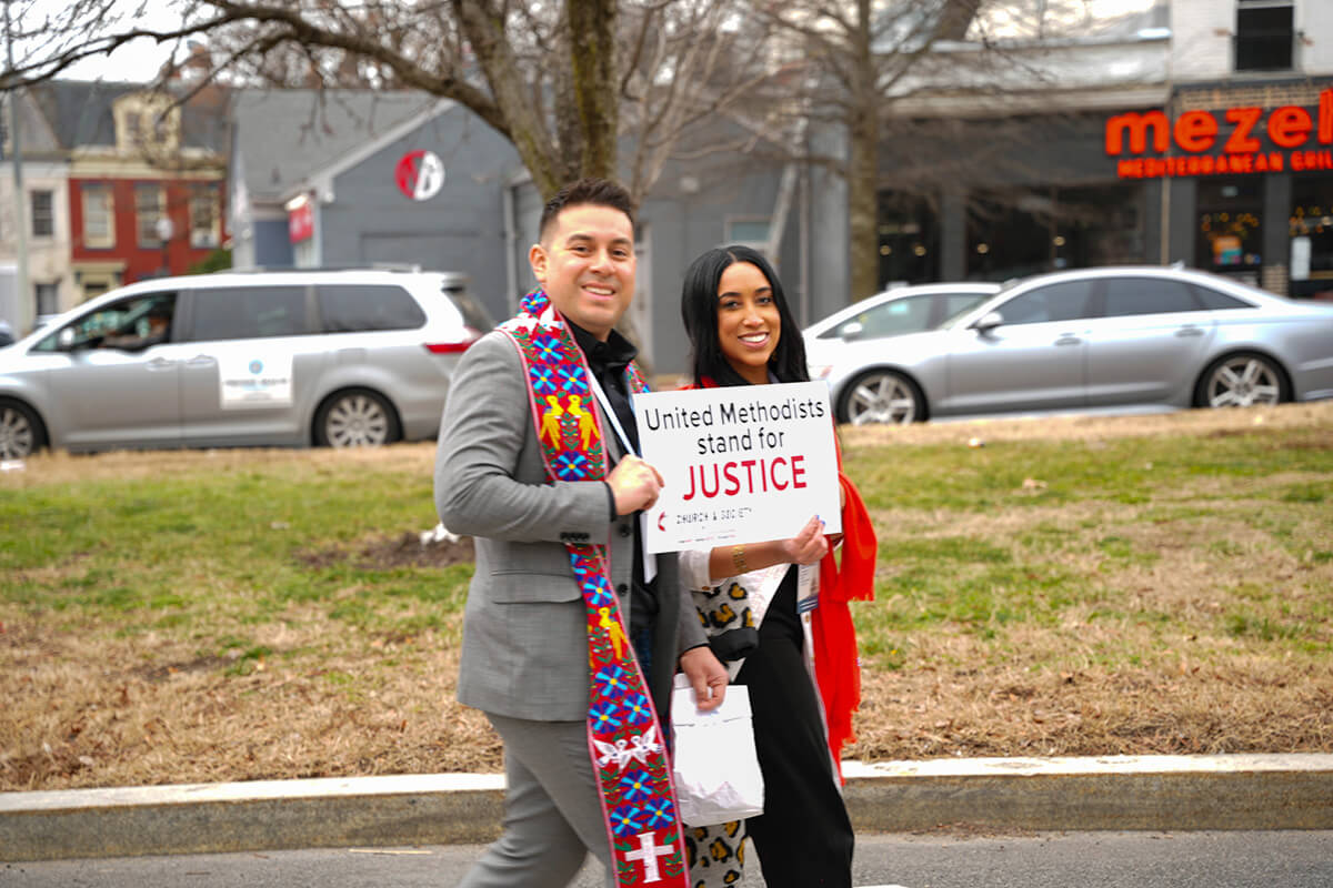 The Rev. Noe Gabe Lopez, director of social impact and belonging in the Eastern Pennsylvania and Greater New Jersey conferences, and his wife, Iliana Lopez Mantos, take part in “Faithful Resistance: A Public Witness for Immigrant Justice” Feb. 25 in Washington, D.C. Rev. Lopez chartered buses so church members from the conferences could join in the United Methodist-led event. Photo courtesy of the Rev. Sarah Borgstrom Lee. 