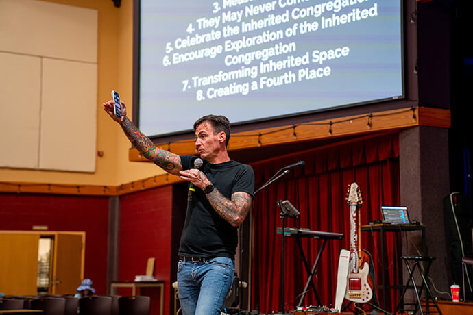 The Rev. Michael Beck speaks to church leaders attending the Fresh Expressions United Methodist National Gathering 2026 at First United Methodist Church in Ocala, Fla. Beck leads the Fresh Expressions initiative in the Florida Conference and  within The United Methodist Church. Photo by Brian Rose, Church of the Restoration in Reston, Va. 