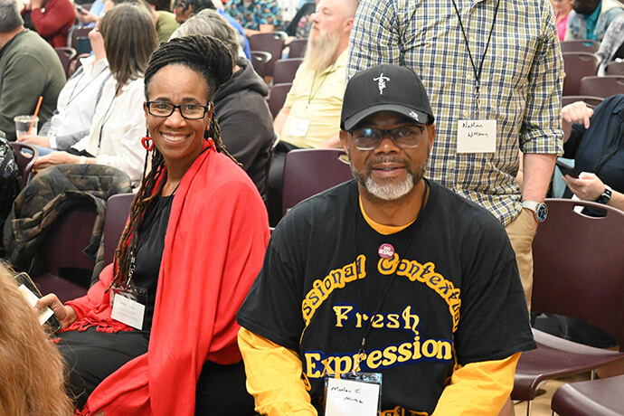 The Rev. Marlon Mack Sr. (right), pastor of Sweet Home Missionary Baptist Church in Gary, Ind., and the Rev. Kenya Ellis (left), pastor of Pleasant Plain United Methodist Church in Gainesville, Fla., wait for the program to begin Feb. 26 at the Fresh Expressions United Methodist National Gathering 2026 at First United Methodist Church in Ocala, Fla. Photo by Jim Patterson, UM News.
