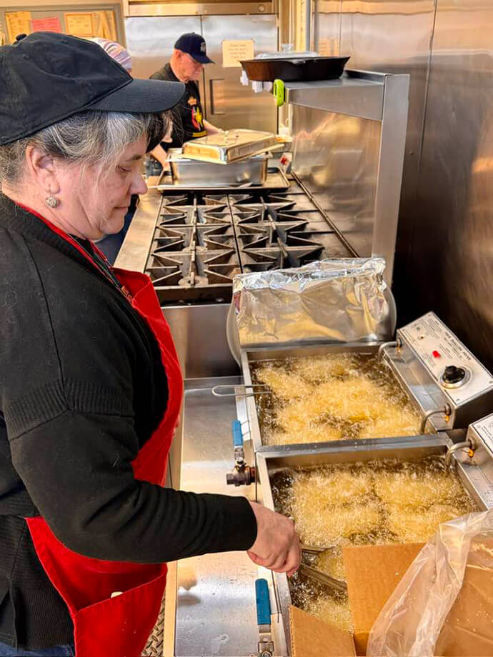 Audrey Green fries up cod for hundreds of diners during a Feb. 27 Lenten fish fry at First United Methodist Church in Kittanning, Pa. In addition to fish and fries, the church offers baked potatoes, macaroni and cheese and homemade pies. Photo by Greg Toth.