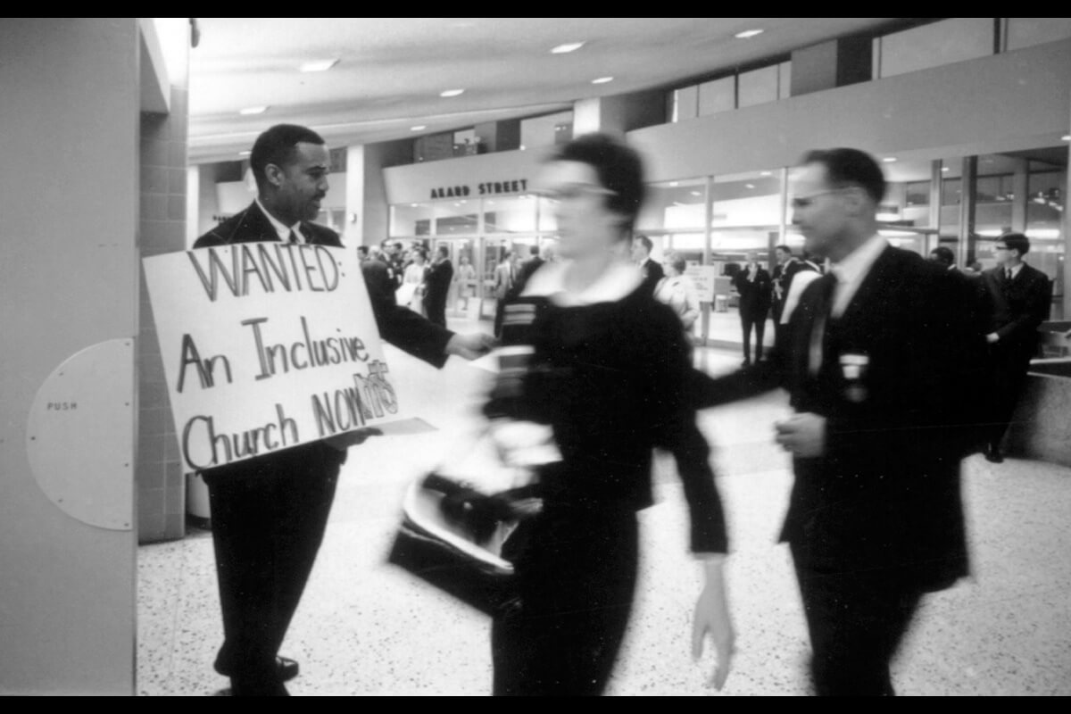 A protester holds a sign seeking an end to racial segregation in the Methodist Church during the 1968 General Conference in Dallas. The conference merged the denomination with the Evangelical United Brethren Church, creating The United Methodist Church, and did away with the racially segregated Central Jurisdiction. A new book by the Rev. Bonnie McCubbin details the long road for Black Methodists to get full equality in the denomination. Photo courtesy of United Methodist Commission on Archives and History.