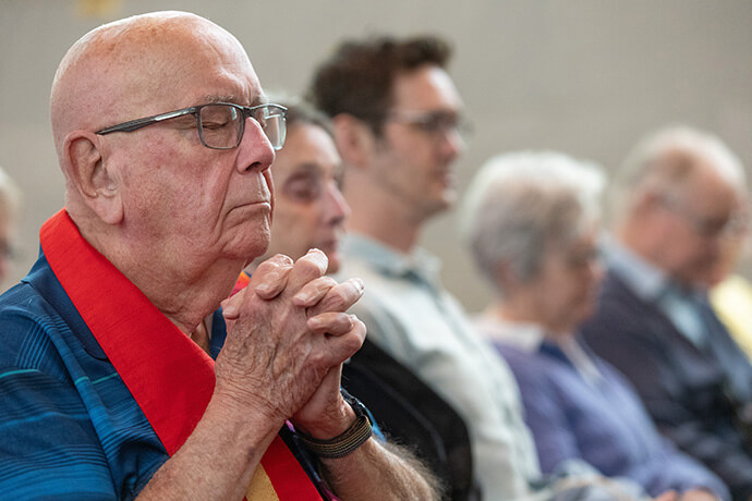 The Rev. Deen Thompson prays during a Palm Sunday Witness at First Evangelical Luthern Church in Nashville, Tenn. 