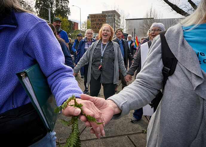 People observe Palm Sunday on March 29 in Eugene, Ore., with an ecumenical public celebration to reclaim Christianity from white nationalism. The event was one of at least 30 Palm Sunday Faith Actions held across the U.S. Photo by Paul Jeffrey, UM News. 