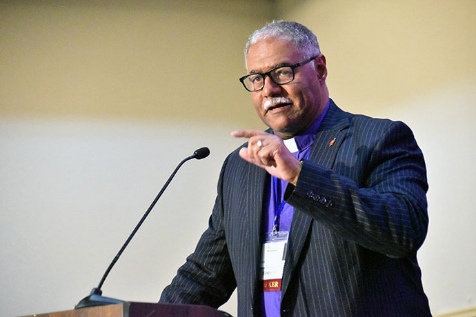 Bishop Julius C. Trimble, top executive of the United Methodist Board of Church and Society, addresses concerns about U.S. immigration enforcement during a “Call to Action” session at the Black Methodists for Church Renewal’s annual gathering March 20. Photo by John W. Coleman, UM News. 