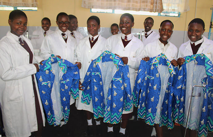 Students at Murewa High School in Murewa, Zimbabwe, display their finished products created in the church school’s new uniform factory. Photo by Kudzai Chingwe, UM News.