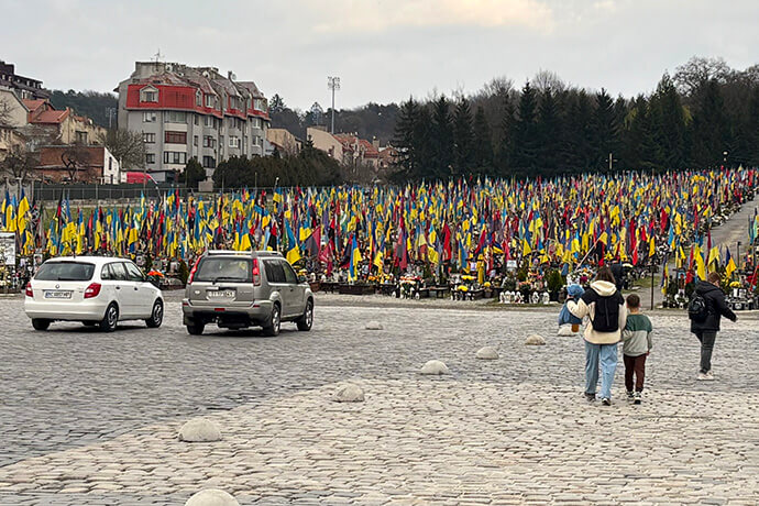 The military cemetery in Lviv, Ukraine, is among the places visited by three European United Methodist bishops during their March trip. Bishop Werner Philipp said it was a moment when the brutality of the war could truly be felt. Photo courtesy of EmK-Öffentlichkeitsarbeit Germany, UM News.