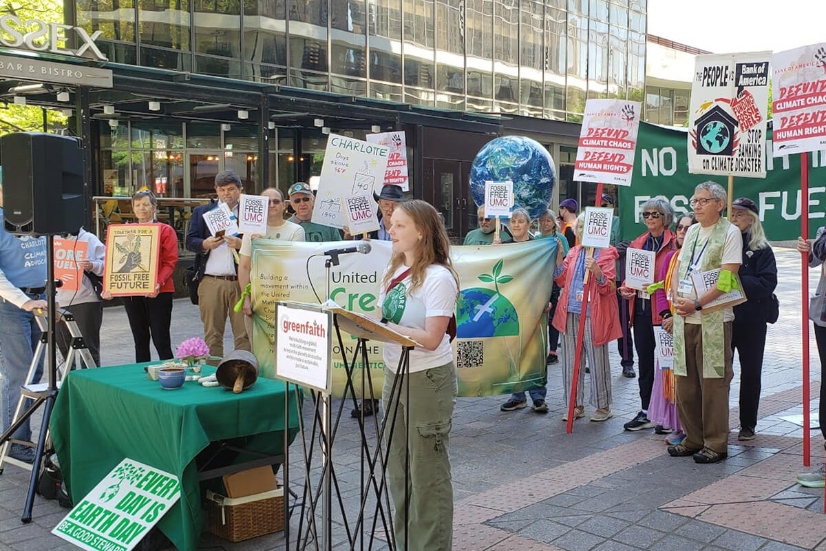 An activist speaks April 23, 2024, during a prayer vigil at the Bank of America headquarters in Charlotte, N.C., to protest the bank’s investments in fossil fuels. Fossil Free UMC and the UM Creation Justice Movement held the rally with local activists during the first day of General Conference 2024 in Charlotte. File photo courtesy of UM Creation Justice Movement.