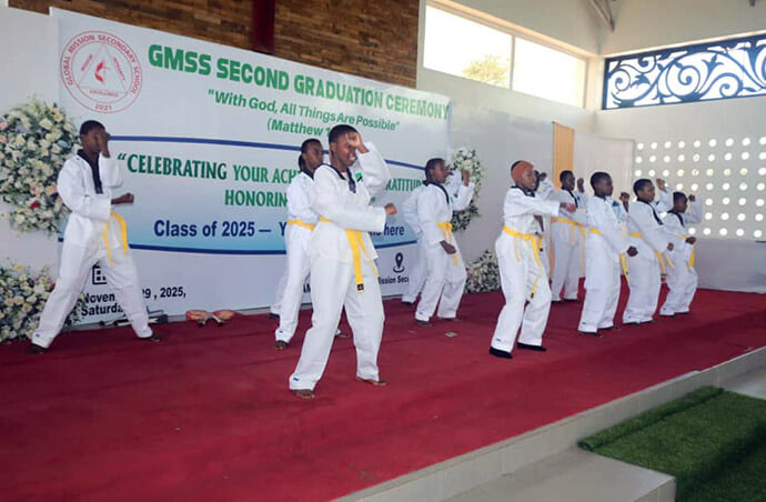 Students from Global Mission Secondary School, dressed in their taekwondo uniforms, perform a martial arts demonstration on stage during the Class of 2025 graduation ceremony in November. Extracurricular activities are an integral part of the school’s holistic approach, aimed at building students’ self-confidence and discipline while helping them discover their talents for God’s service. Photo by Asaph Sungura Ally, UM News.
