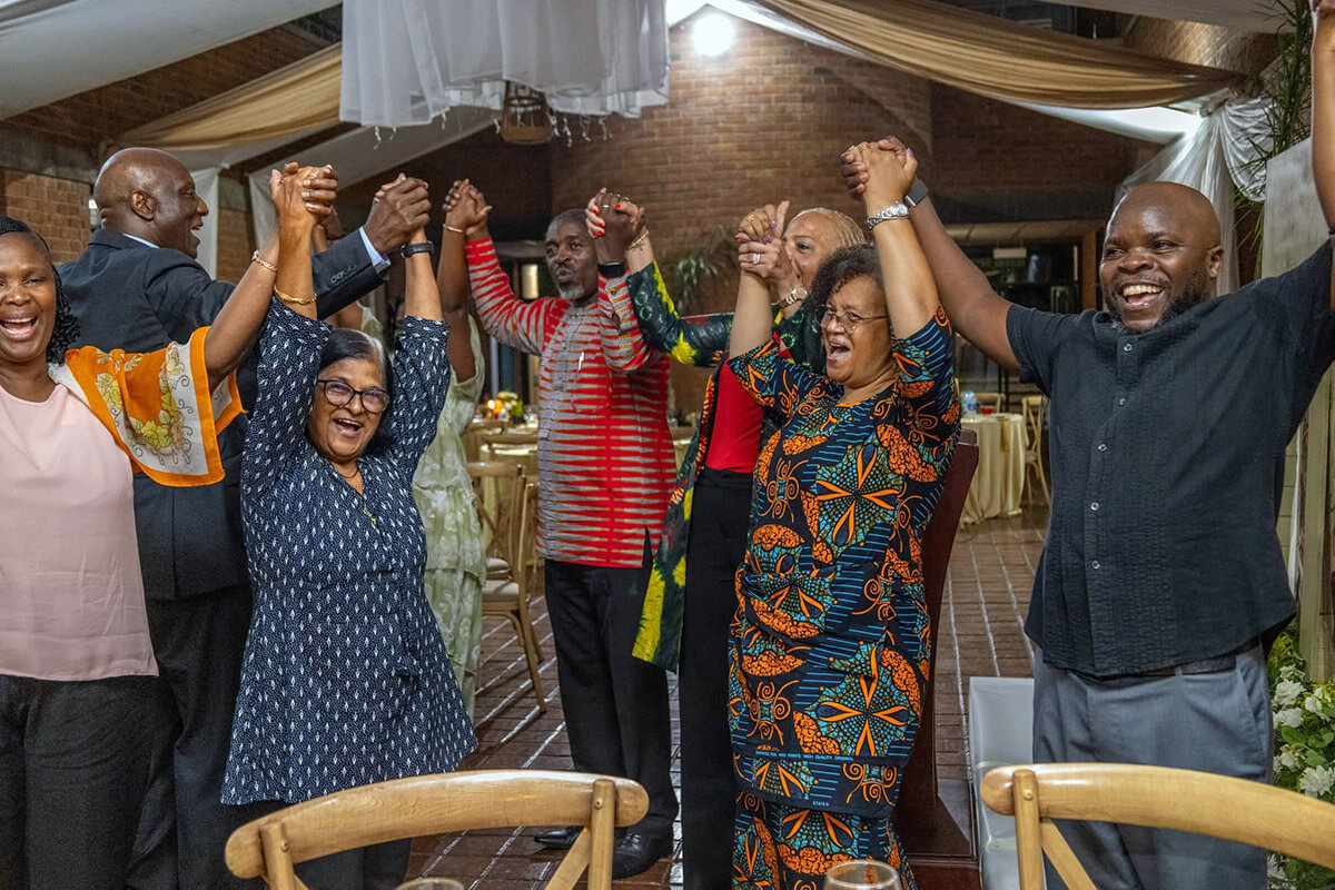Africa University board members and staff celebrate during a dinner to mark the end of the March meetings at the United Methodist-related university in Mutare, Zimbabwe. The university introduced new board members and welcomed them to the institution during the event. Photo courtesy of Africa University Advancement and Public Affairs Office.