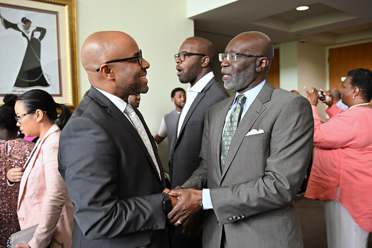 Gubernatorial candidate Olu Brown (left) mingles during a campaign event. The retired United Methodist pastor is running in the May 19 Democratic primary election in Georgia. Photo courtesy of the Olu Brown campaign.