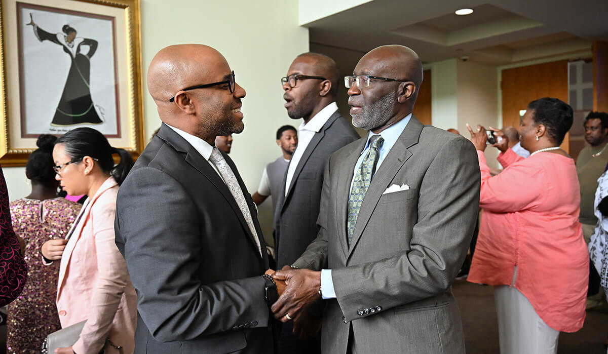 Gubernatorial candidate Olu Brown (left) mingles during a campaign event. The retired United Methodist pastor is running in the May 19 Democratic primary election in Georgia. Photo courtesy of the Olu Brown campaign.