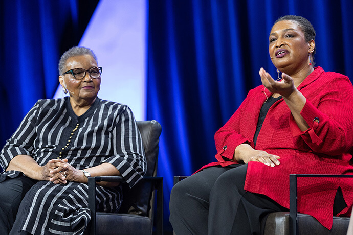 Stacey Abrams (right) and her mother, the Rev. Carolyn Abrams, address the United Women in Faith Assembly 2026 in Indianapolis. Photo by Mike DuBose, United Women in Faith.