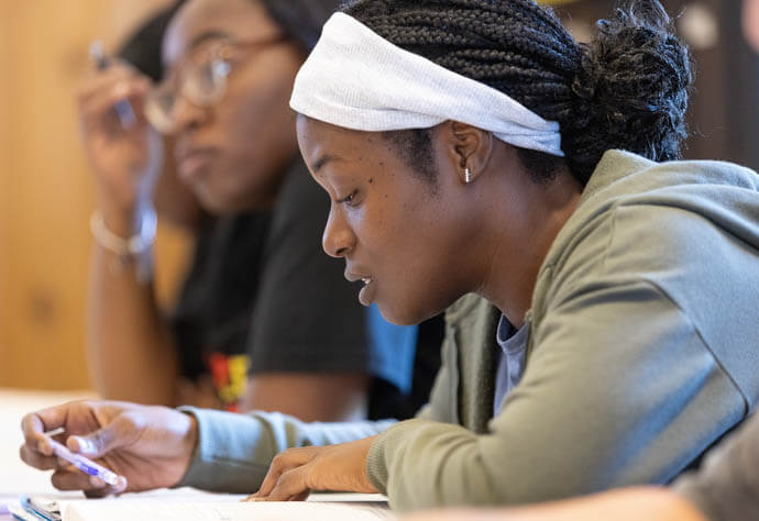 Gnyia McDonald reads aloud from a textbook at the Women in Construction program. Classes cover topics such as conflict resolution, how to deal with sexual harassment on the job site and how to give and receive constructive criticism. 