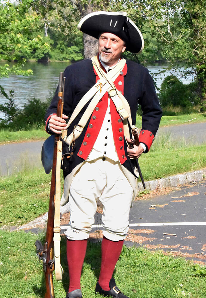Historian Mark Sirak wears a Continental Army uniform during his historical presentation to the Northeastern Jurisdiction Archives and History commission members. Sirak is a member of Titusville United Methodist Church. Photo by John W. Coleman, UM News.
