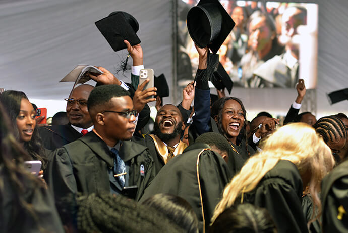 Graduates from Africa University’s class of 2026 cheer in celebration during the 32nd commencement ceremony on June 6. Photo courtesy of the Africa University Public Affairs Office.