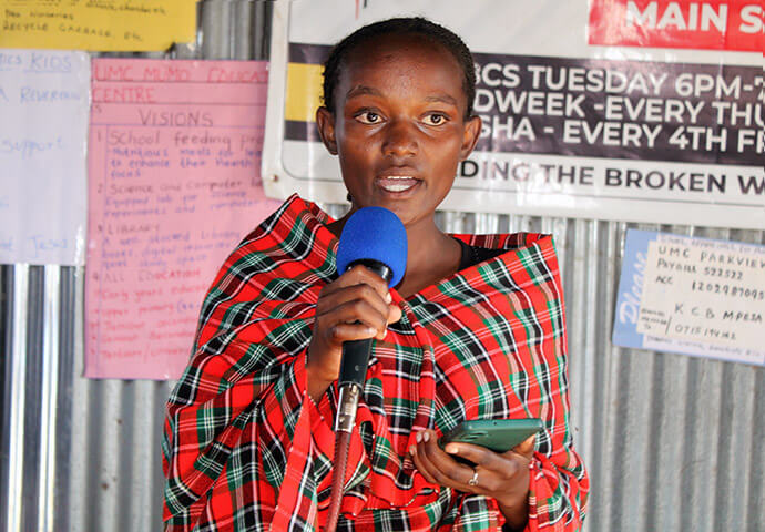 Jackline Mwende shares information about the No Girl No Cry initiative with visitors from the United Methodist boards of Global Ministries and Higher Education and Ministry, who visited Parkview Kitengela United Methodist Church during their spring board meeting April 8-10 in Nairobi. Photo by Kudzai Chingwe, UM News.