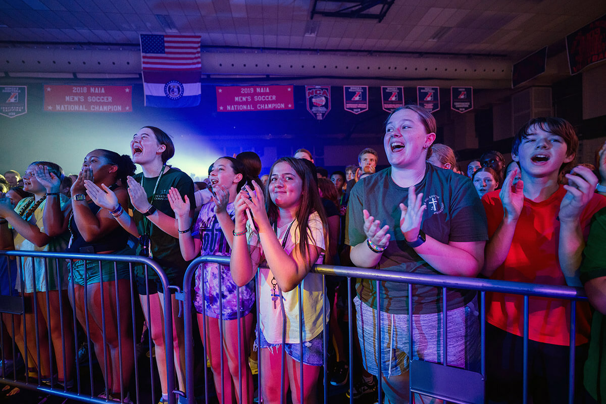 Teens clap and sing during one of two UNITE youth retreats sponsored by the Missouri Conference in July 2025 at Central Methodist University in Fayette, Missouri. United Methodist conferences in the U.S. are seeing growth at annual youth retreats after years of slowdown following the COVID pandemic. File photo by Schaefer Photography.