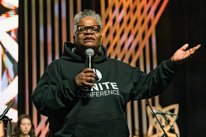 Bishop LaTrelle M. Easterling, who leads the Baltimore-Washington and Peninsula-Delaware conferences, prays for attendees at the March 2026 IGNITE youth retreat in Ocean City, Maryland. Photo by Alison Burdett, Baltimore-Washington Conference.