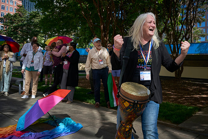 Marcia McFee and others celebrate on May 1, 2024, after the United Methodist General Conference, meeting in Charlotte, N.C., voted to remove the denomination's ban on the ordination of “self-avowed practicing” gay clergy — a prohibition that dated to 1984. File photo by Paul Jeffrey, UM News.