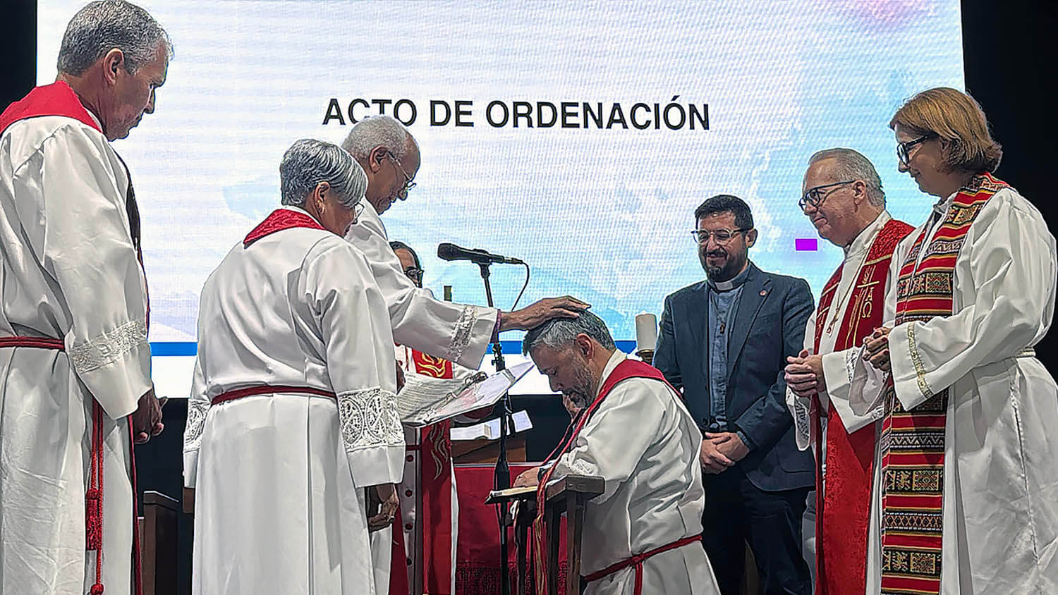 Bishop Lizzette Gabriel Montalvo and Bishop Emeritus Rafael Moreno participate in the ordination of the Rev. Luis Daniel Román during the conference's ordination service. Photo by the Rev. Gustavo Vásquez, UM News.