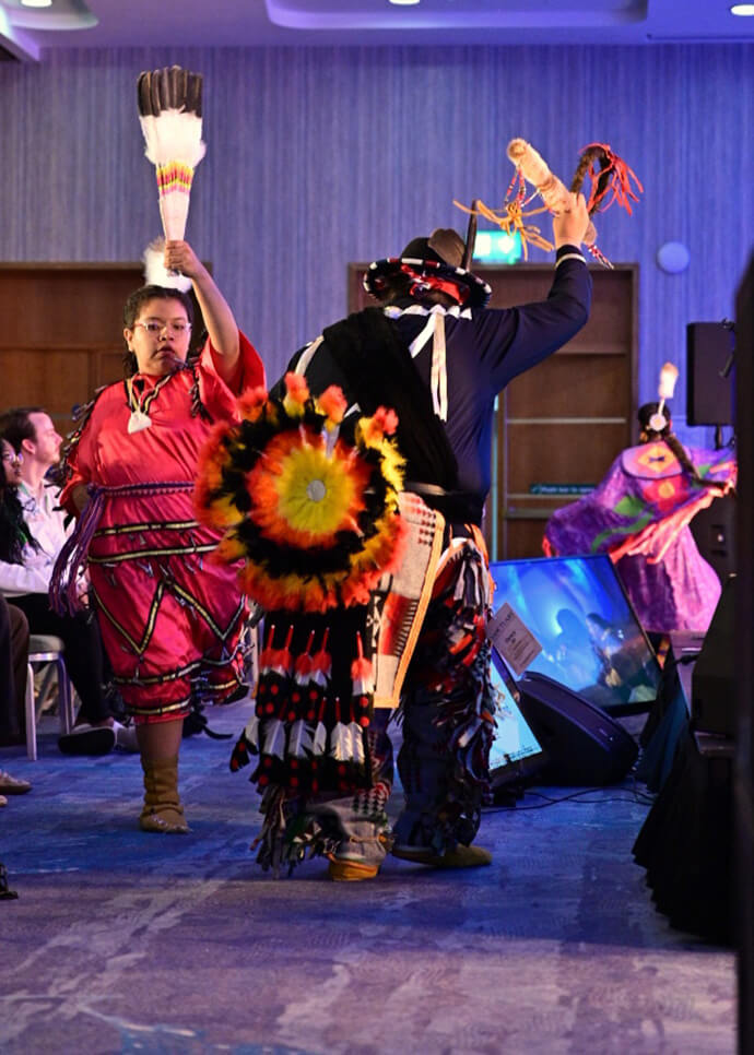 The Mending Wings group from the Yakama Nation in southern Washington share music and liturgical dances from their culture during one of their working sessions, where they also discussed historical context and the importance of deepening decolonization within church discipleship. Photo by the Rev. M. Scott Hughes, Discipleship Ministries.