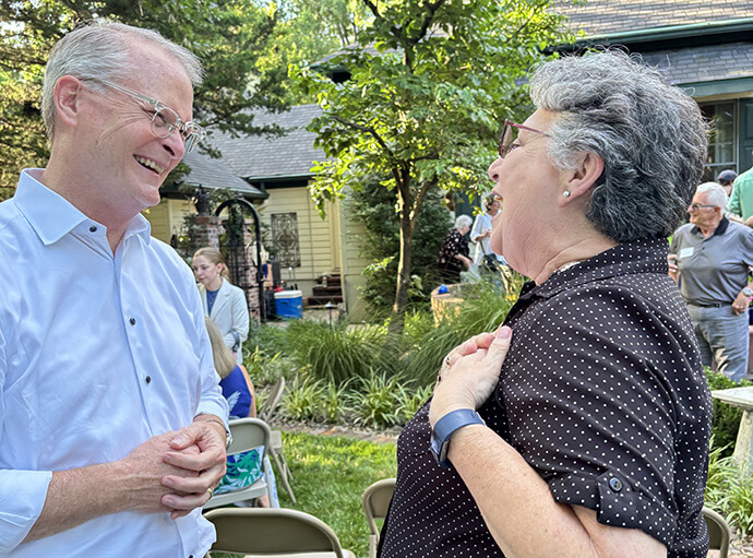 At a June 1 Crawford County Democrats meet and greet on June 1, the Rev. Adam Hamilton (left) talks about the issues with a voter. Hamilton is running in the primary election to be the Democratic nominee for senator in Kansas. Photo courtesy of the Hamilton campaign.