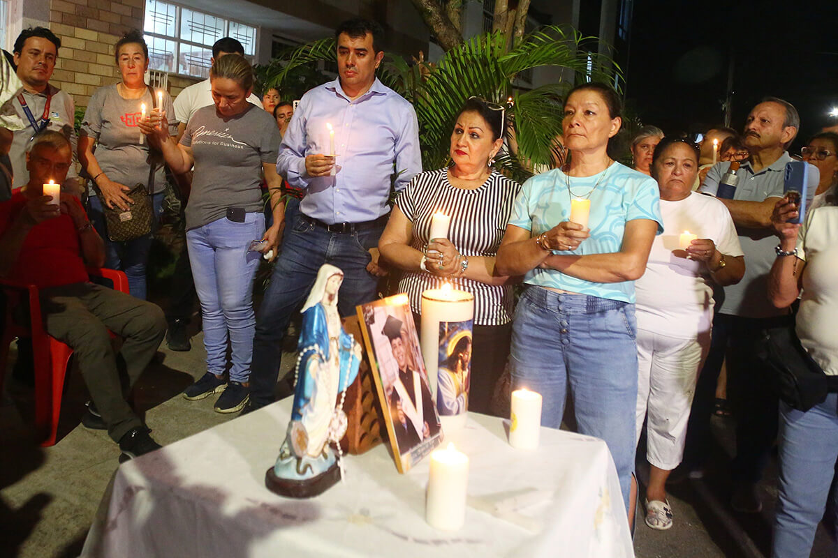Friends and relatives in Bucaramanga, Colombia, hold a vigil July 14 for Johan Sebastián Durán Guerrero, a Colombian national who was fatally shot by an Immigration and Customs Enforcement officer in Maine. The Maine Immigrants’ Rights Coalition said Durán Guerrero was legally authorized to work in the U.S. Photo by Jaime Moreno, AP.