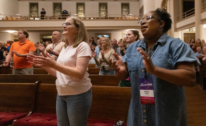 Lindy Thompson (left) and Felicia Patton join in singing during the Fusion 2026 Worship Music Conference.