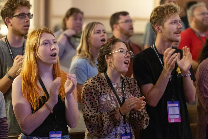 Students from the Wesley Foundation at Appalachian State University sing during opening worship for the Fusion 2026 Worship Music Conference. From left, front, are Star Sessler, Grace Bragg and Caleb Sprouse. 