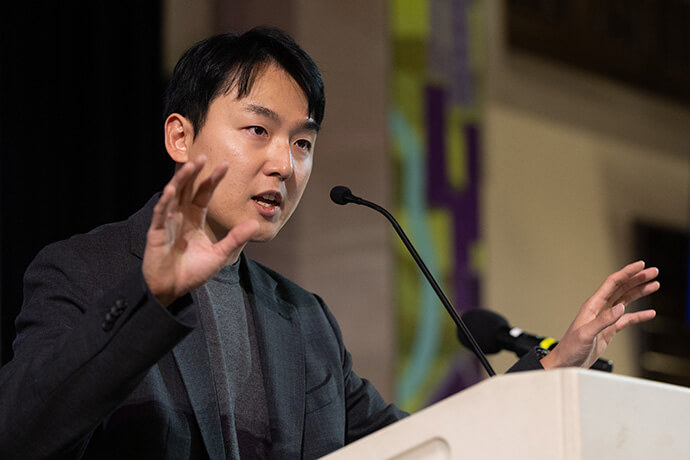 The Rev. YoungHak Lee teaches the practice of tongsung prayer during morning worship Oct. 22 at the United Methodist Leadership Gathering at Knox United Church in Calgary, Canada. The Korean-style prayer is the practice of praying one’s own prayers aloud at the same time as others. Photo by Mike DuBose, UM News.
