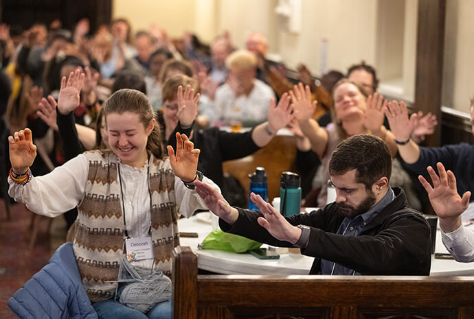 Participants in the United Methodist Leadership Gathering take part in tongsung prayer, a Korean-style practice of praying aloud simultaneously. Photo by Mike DuBose, UM News.