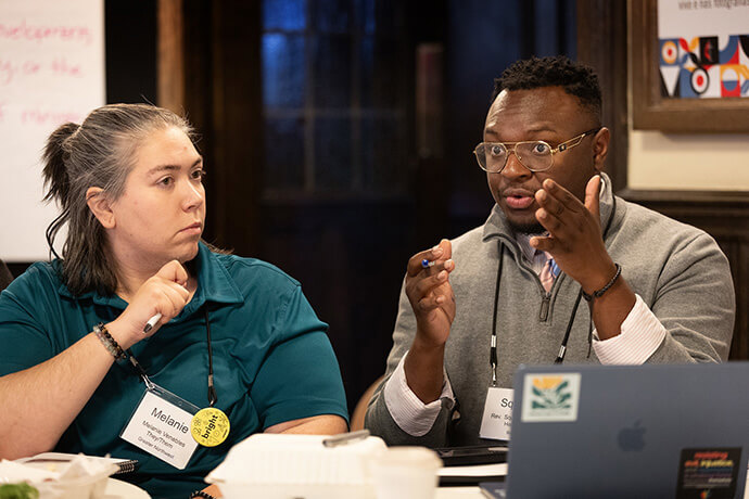 Melanie Venables (left) and the Rev. Squire Prince take part in a discussion during a meeting of the accountability cohort at the United Methodist Leadership Gathering on Oct. 22. Photo by Mike DuBose, UM News.